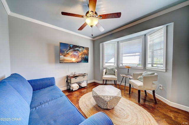 living room featuring crown molding, baseboards, wood finished floors, and ceiling fan