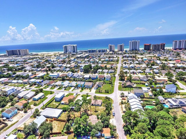 aerial view of residential area featuring a large body of water