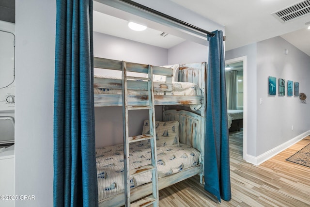 15625 Front Beach Rd Unit 1405, Panama City Beach, FL 32413 - bedroom featuring baseboards, wood finished floors, and visible vents