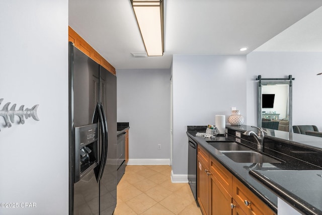 15625 Front Beach Rd Unit 1405, Panama City Beach, FL 32413 - kitchen featuring a sink, brown cabinets, black appliances, and dark countertops