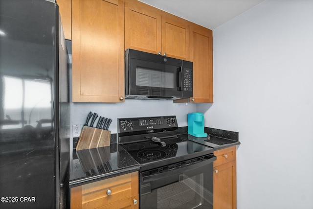 15625 Front Beach Rd Unit 1405, Panama City Beach, FL 32413 - kitchen with dark stone counters, brown cabinetry, and black appliances