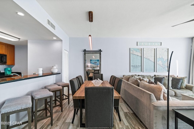 15625 Front Beach Rd Unit 1405, Panama City Beach, FL 32413 - dining room featuring recessed lighting, visible vents, and light wood-style flooring