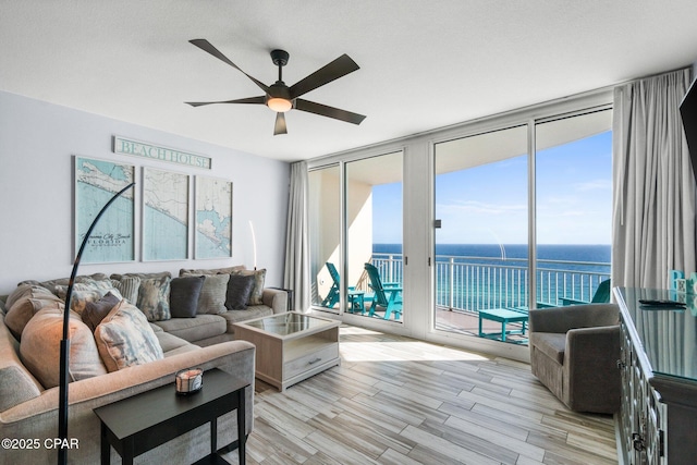 15625 Front Beach Rd Unit 1405, Panama City Beach, FL 32413 - living area with light wood finished floors, a water view, floor to ceiling windows, and ceiling fan
