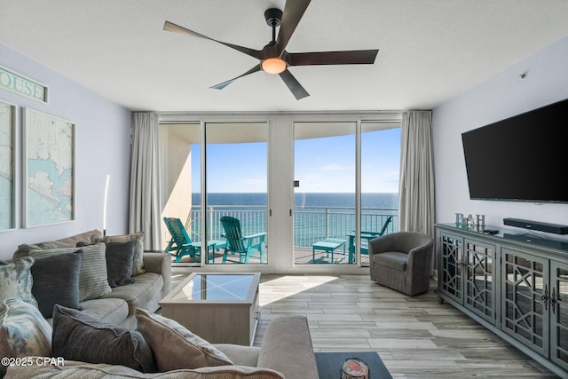 15625 Front Beach Rd Unit 1405, Panama City Beach, FL 32413 - living room with ceiling fan, wood finished floors, and a wall of windows