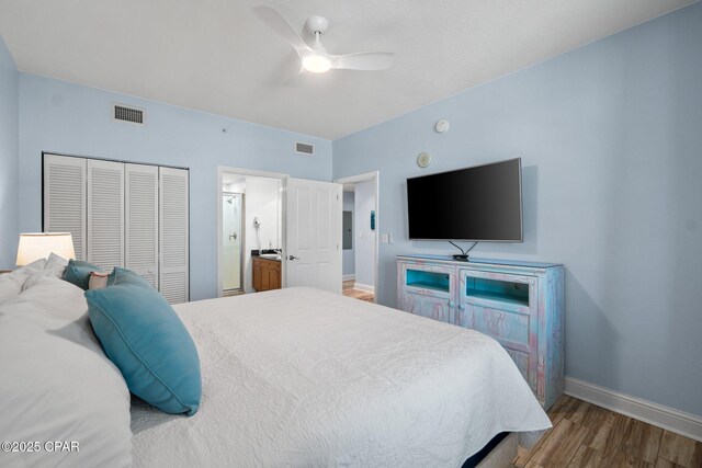 15625 Front Beach Rd Unit 1405, Panama City Beach, FL 32413 - bedroom featuring visible vents, a closet, wood finished floors, baseboards, and ensuite bathroom