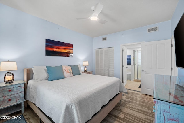 15625 Front Beach Rd Unit 1405, Panama City Beach, FL 32413 - bedroom featuring visible vents, ensuite bathroom, wood finished floors, and a closet
