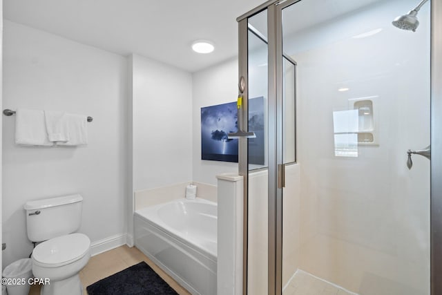 15625 Front Beach Rd Unit 1405, Panama City Beach, FL 32413 - bathroom featuring a bath, tile patterned flooring, a shower stall, baseboards, and toilet