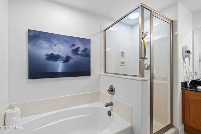 15625 Front Beach Rd Unit 1405, Panama City Beach, FL 32413 - bathroom featuring vanity, a shower stall, and a garden tub