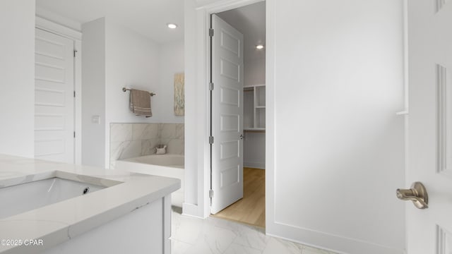 934 Crystal Bayou Blvd, Panama City Beach, FL 32407 - full bath featuring marble finish flooring, recessed lighting, baseboards, a bath, and vanity