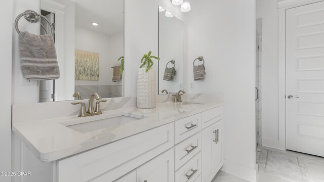 934 Crystal Bayou Blvd, Panama City Beach, FL 32407 - bathroom featuring marble finish flooring, double vanity, and recessed lighting
