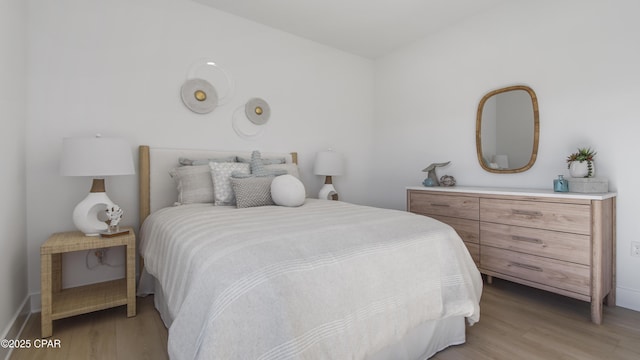934 Crystal Bayou Blvd, Panama City Beach, FL 32407 - bedroom with light wood-type flooring and baseboards