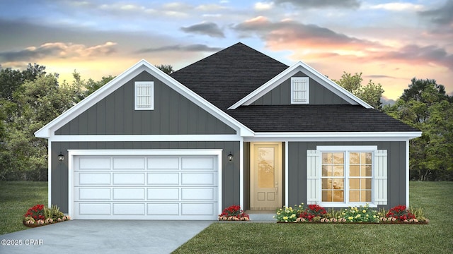 view of front of property featuring board and batten siding, driveway, roof with shingles, a yard, and an attached garage