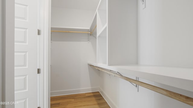 spacious closet with light wood-style floors