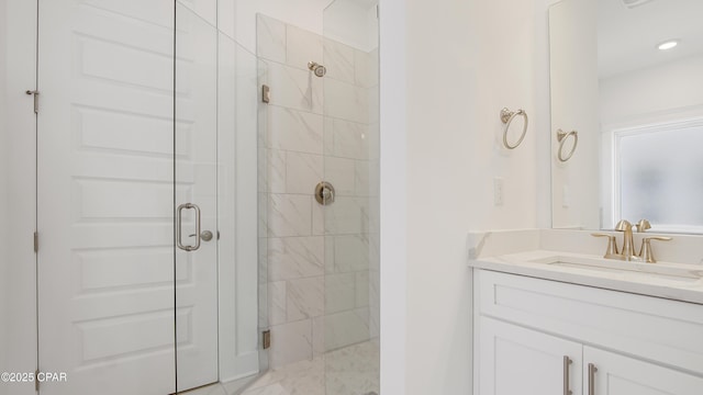 bathroom featuring vanity and a stall shower