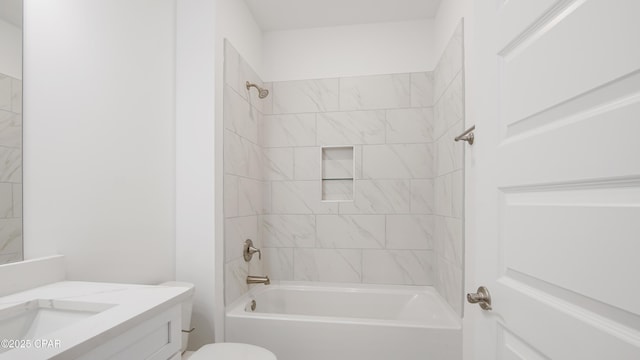 bathroom with vanity, toilet, and shower / washtub combination