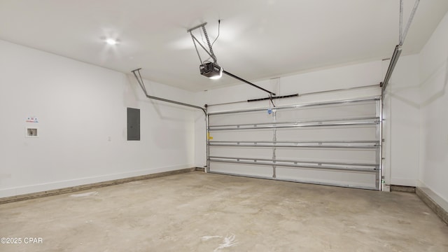 garage with baseboards, a garage door opener, and electric panel