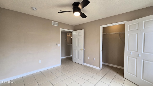 4075 Dancing Cloud Ct Unit 197, Destin, FL 32541 - unfurnished bedroom featuring a textured ceiling, a closet, light tile patterned floors, baseboards, and visible vents