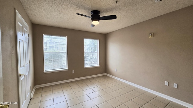 4075 Dancing Cloud Ct Unit 197, Destin, FL 32541 - unfurnished room featuring baseboards, a ceiling fan, a textured ceiling, and light tile patterned flooring