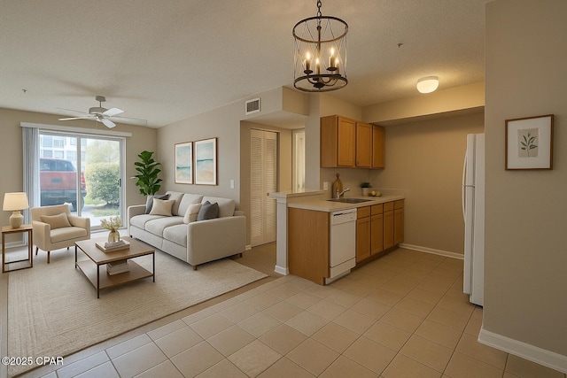 4075 Dancing Cloud Ct Unit 197, Destin, FL 32541 - kitchen featuring open floor plan, white appliances, light countertops, and a sink
