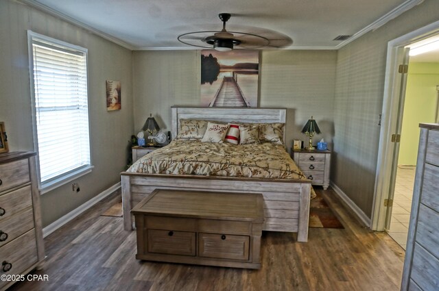 5585 Suncrest Rd, Marianna, FL 32448 - bedroom featuring crown molding, dark wood-style floors, baseboards, and ceiling fan