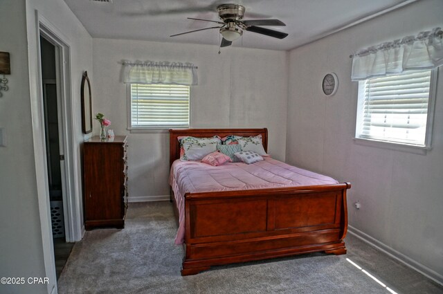5585 Suncrest Rd, Marianna, FL 32448 - carpeted bedroom with a ceiling fan and baseboards