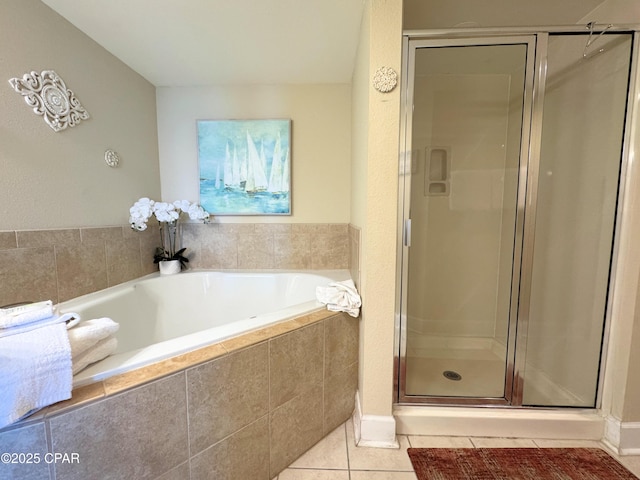 full bath with tile patterned flooring, a stall shower, and a bath