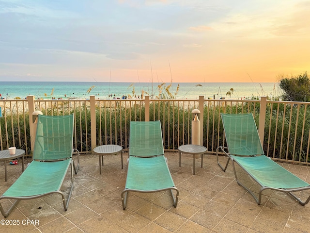 view of patio featuring a water view