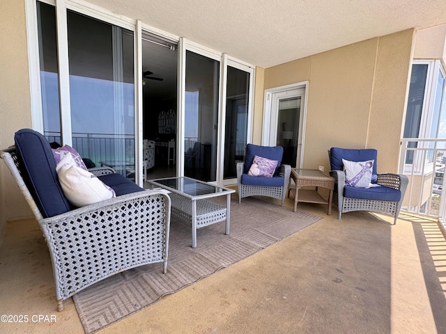 view of patio featuring a balcony
