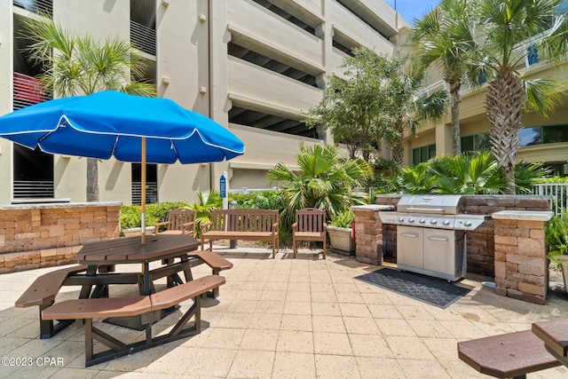 view of patio / terrace featuring area for grilling and outdoor dining space