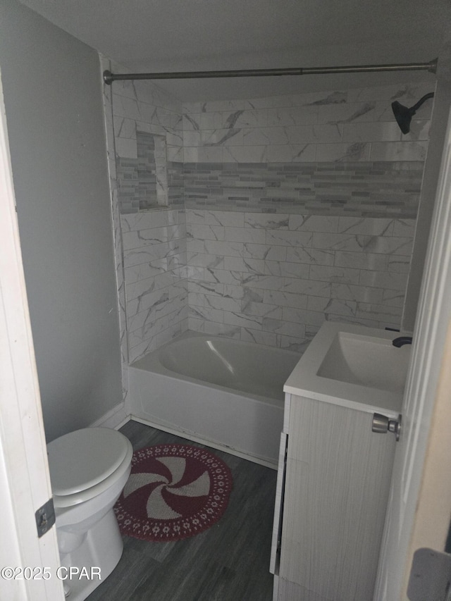 2707 W 18th St, Panama City, FL 32405 - full bath with vanity, shower / tub combination, wood finished floors, and toilet