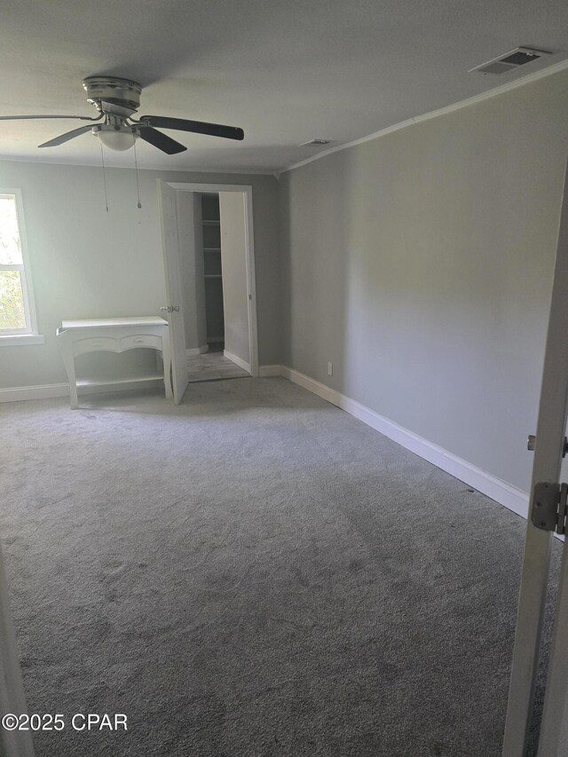 2707 W 18th St, Panama City, FL 32405 - spare room featuring carpet floors, baseboards, a ceiling fan, and visible vents