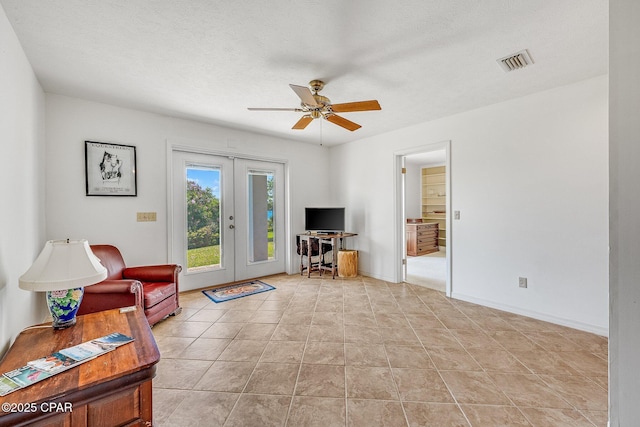 living room featuring visible vents, a ceiling fan, baseboards, and french doors