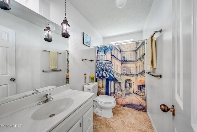bathroom featuring vanity, curtained shower, toilet, a textured ceiling, and tile patterned floors