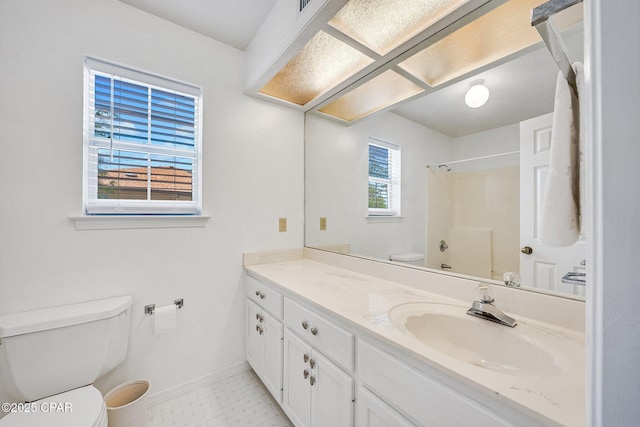 full bathroom featuring baseboards, vanity, toilet, and a shower