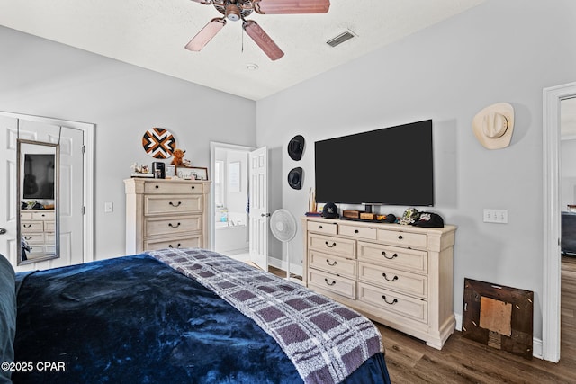 2501 Pelican Bay Dr, Panama City, FL 32408 - bedroom with wood finished floors, baseboards, and a ceiling fan