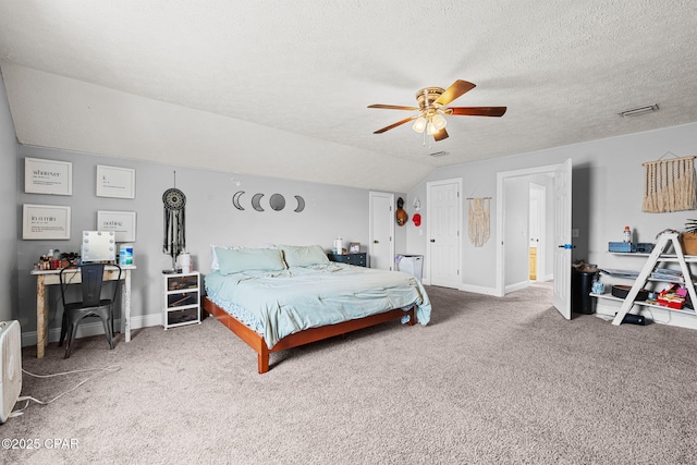 2501 Pelican Bay Dr, Panama City, FL 32408 - carpeted bedroom with an office area, vaulted ceiling, baseboards, a textured ceiling, and ceiling fan