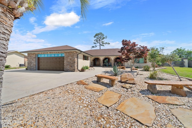 view of front of home featuring driveway and an attached garage