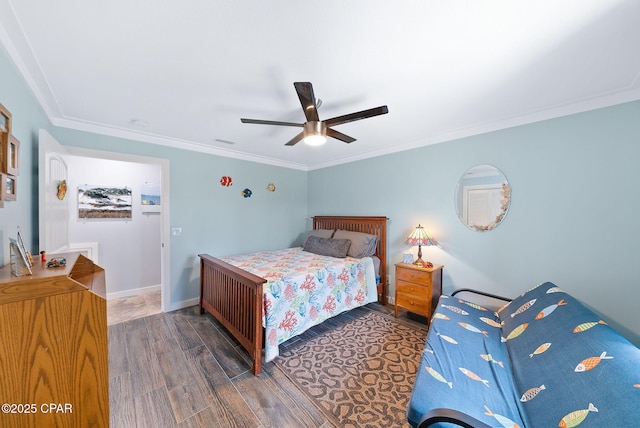 bedroom featuring visible vents, baseboards, a ceiling fan, wood finished floors, and crown molding