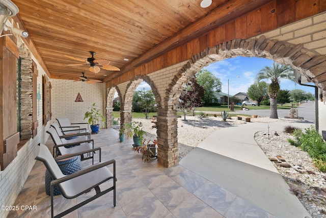 view of patio featuring ceiling fan