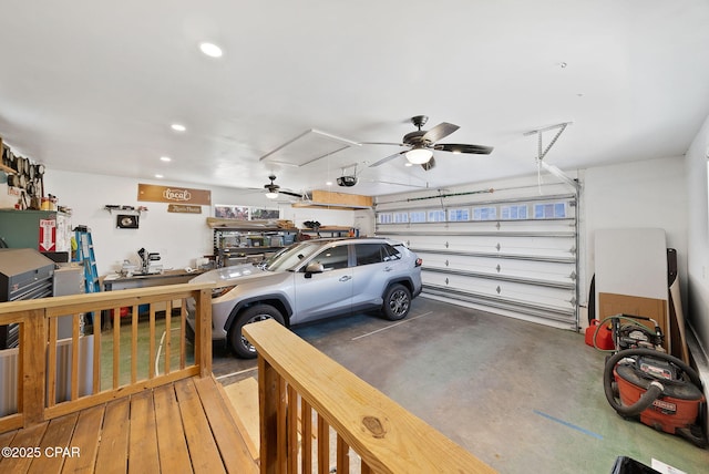 garage with recessed lighting, a garage door opener, and ceiling fan