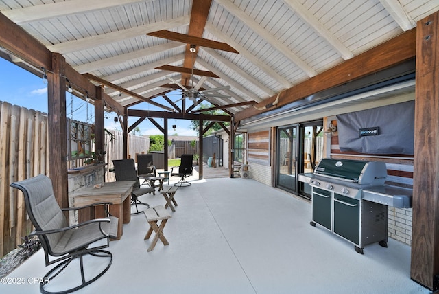 view of patio with area for grilling, a ceiling fan, a gazebo, and fence