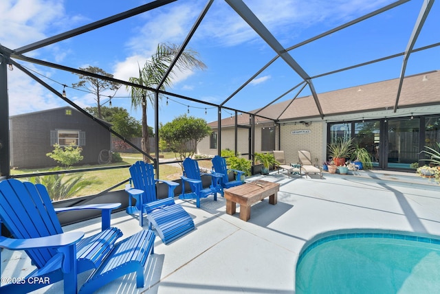 outdoor pool with a patio and glass enclosure