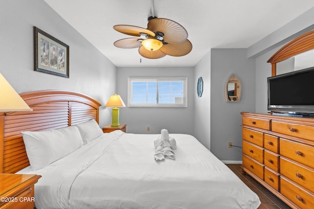 bedroom with baseboards and a ceiling fan
