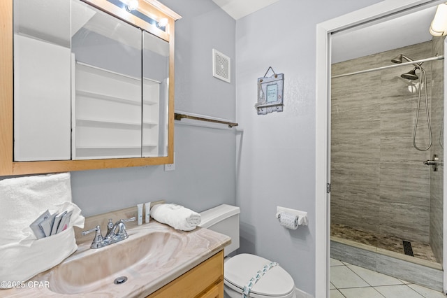 full bathroom with tile patterned flooring, vanity, toilet, visible vents, and tiled shower