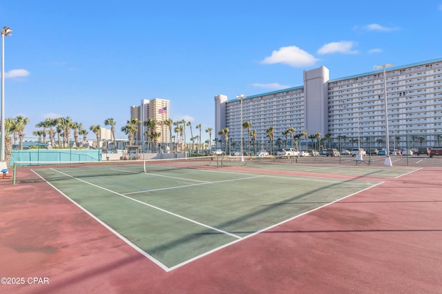 view of tennis court with fence