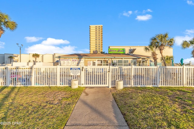 view of front of house featuring fence and stucco siding