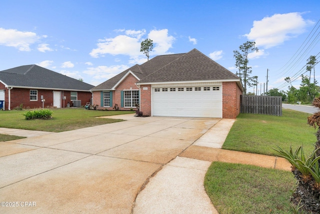 ranch-style home with concrete driveway, a garage, a front lawn, and brick siding