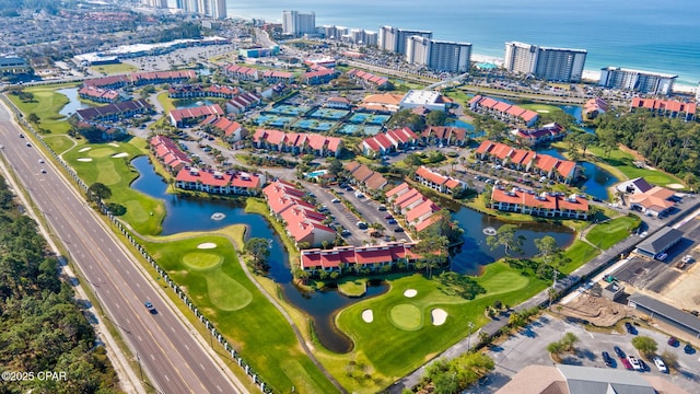 drone / aerial view with a view of city and a water view