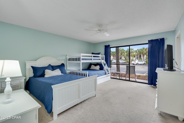 bedroom with a ceiling fan, access to outside, and carpet flooring