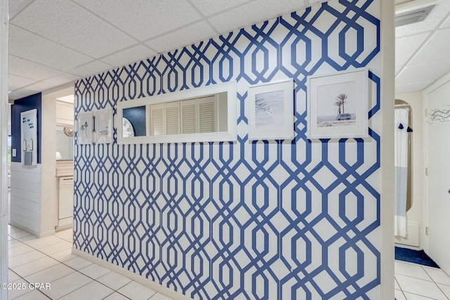 interior space with a drop ceiling